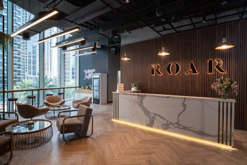 Modern gym interior with Olympic lifting platforms and 25-meter sprint track at Roar Fitness Dubai.